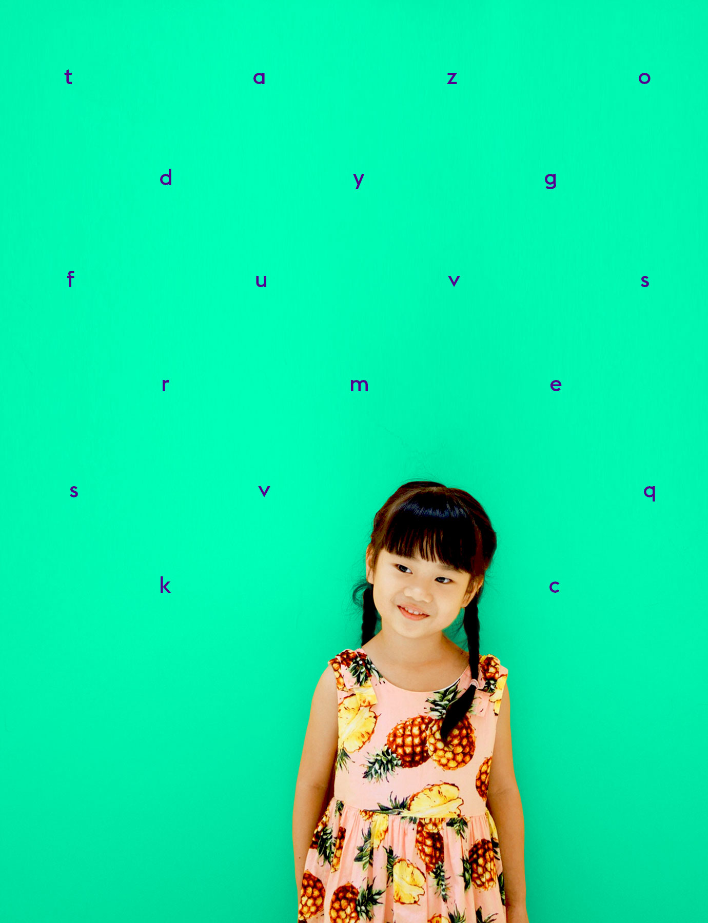 asian girl against a wall with letters on it